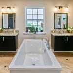 Luxury bathroom customized with central bath and separate floating sink counters