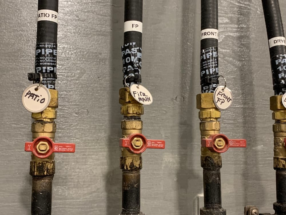 Gas pipes with labels to identify area of output