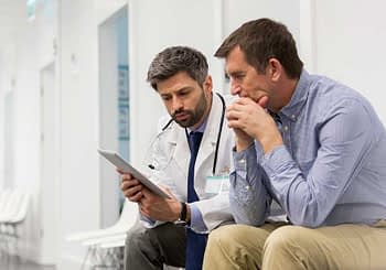 Patient Reviewing Information With Doctor