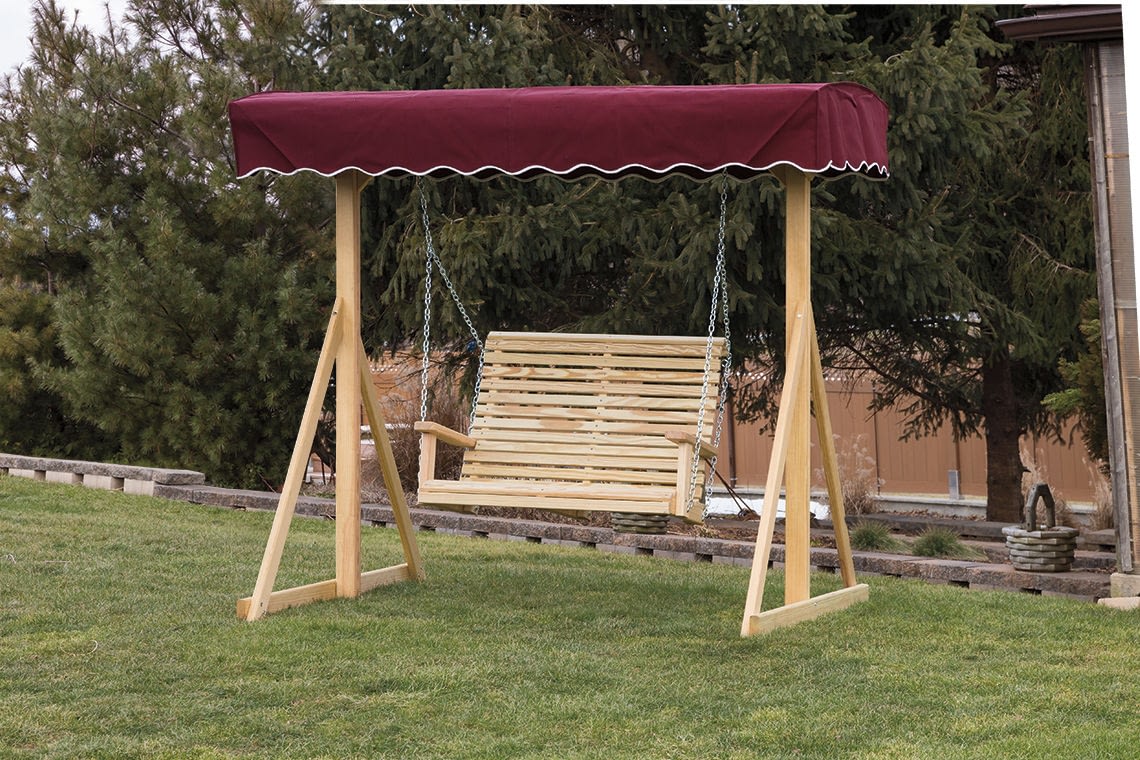 A wooden lawn swing with a canopy