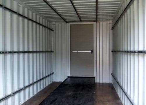 TRS Containers installs steel ramps to roll eqiupment into a steel ISO container for shipping or storage