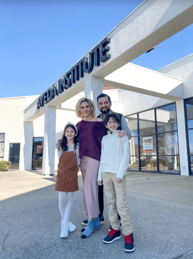 Aveda graduate Laura Tamez posed with husband and children