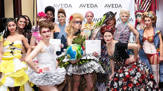 A group of Aveda models during an earth ay event, dressed in recycled clothing
