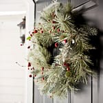 Christmas wreath on front door of custom home