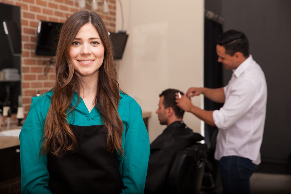 Female hairstylist smiling 