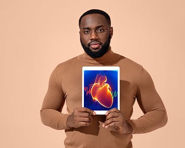 Man Showing Image Of Heart.