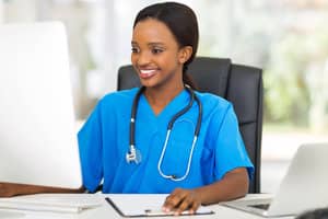 young Health Information Technician african female doctor using computer