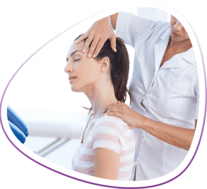 Massage therapist places hands on neck of seated client