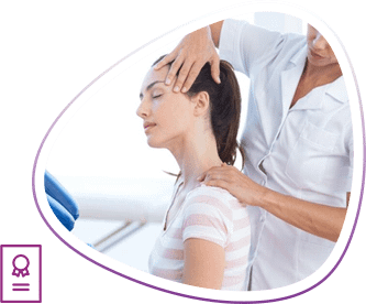 Massage technician performs chair massage on temples and neck of client