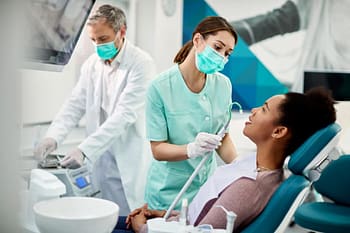 Dental Assistant Helping Dentist During A Patient’s Visit
