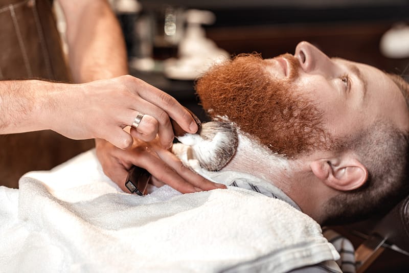 Man getting a beard shave