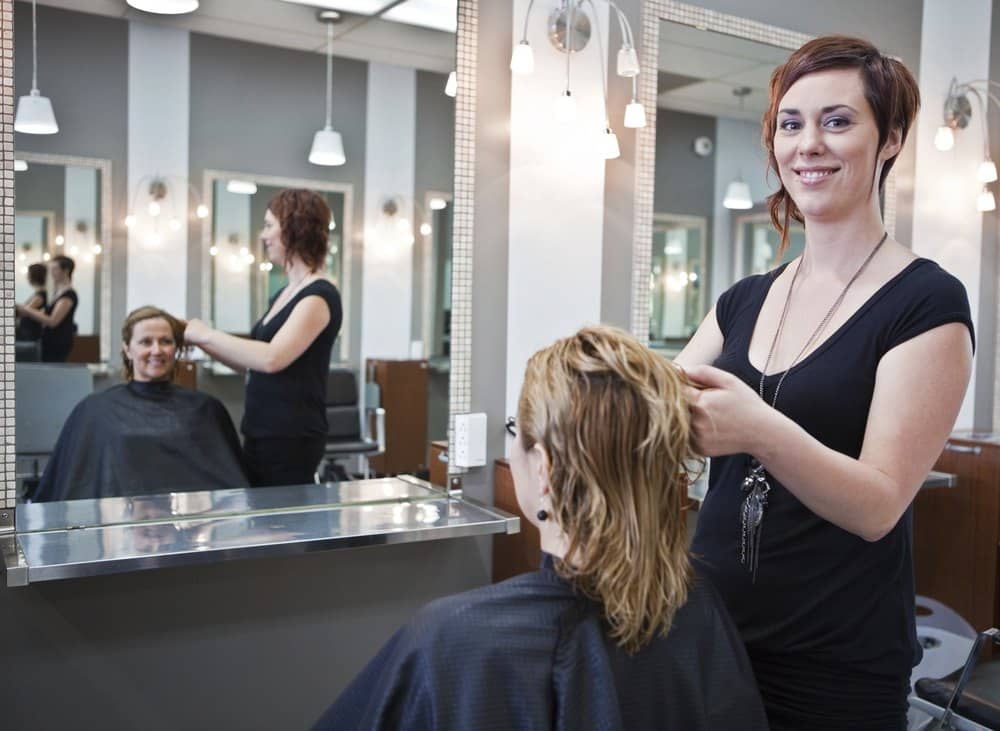 stylist working with a guest in a professional salon