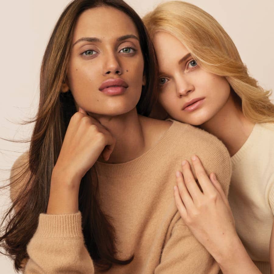 two beautiful Aveda models posing for picture