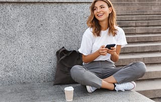 Girl Smiling With Phone