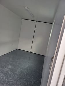 20ft long shipping container office interior. Swing doors still operable.