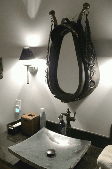 Bathroom vanity and sink with saddle mirror