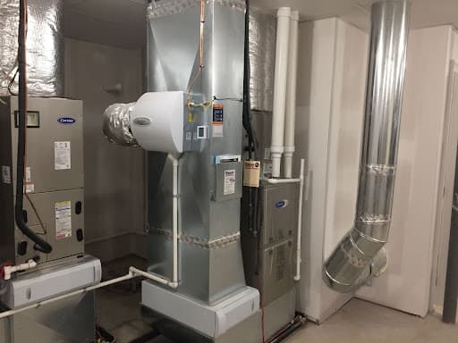 A newly installed gas furnace is pictured in a basement.