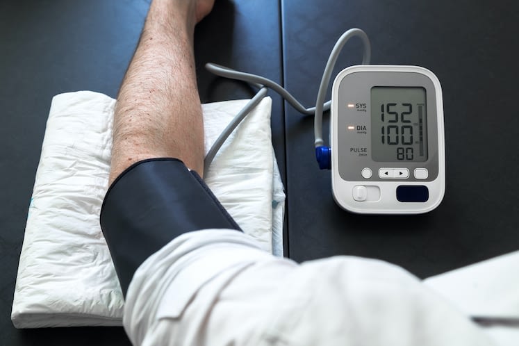 Hypertensive patient performing a blood pressure auto test