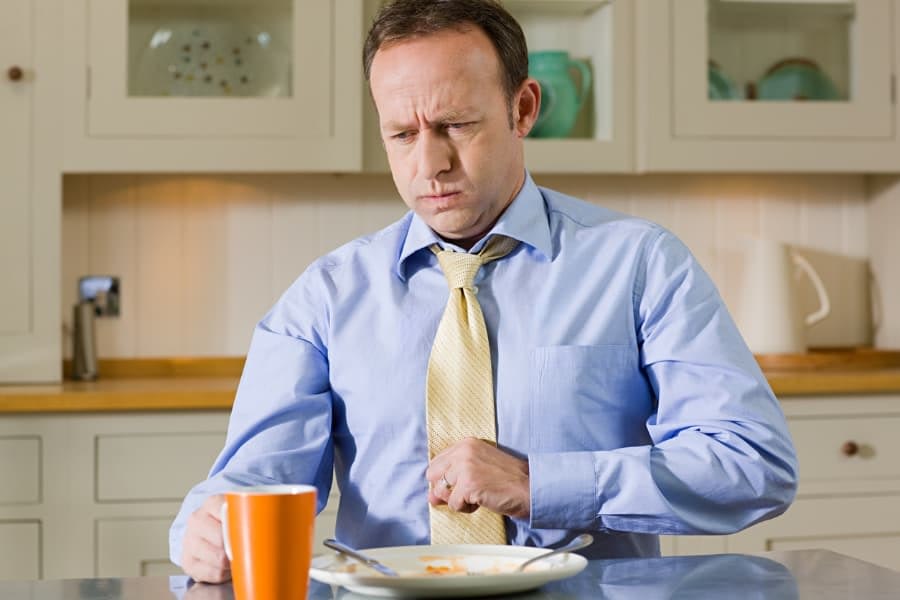 Man Experiencing Discomfort After Overeating