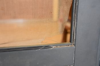 Torn corner of screen door