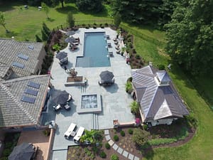 Overhead view of landscaped backyard with swimming pool