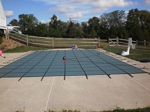 Pool cover with tools on top
