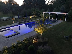 Long custom designed pool lit for the evening