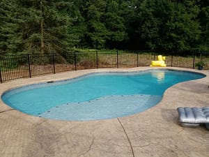 Plain freeform pool and patio