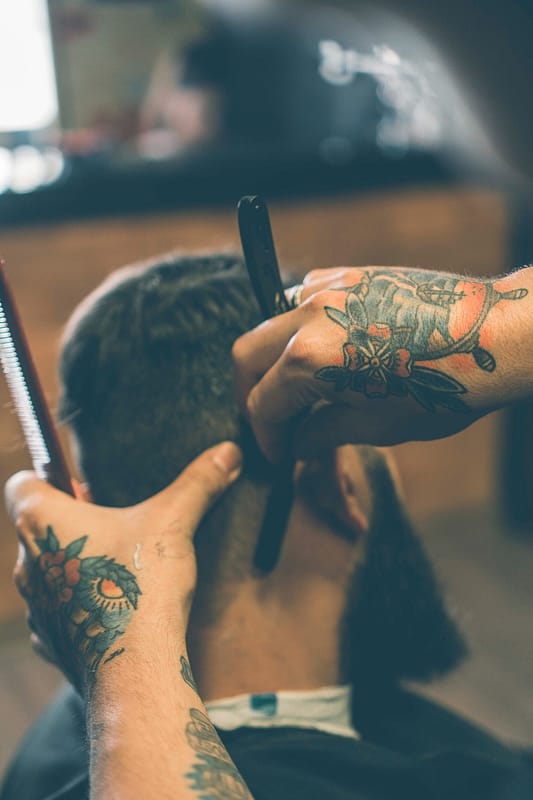 Man getting a shave in a barbershop