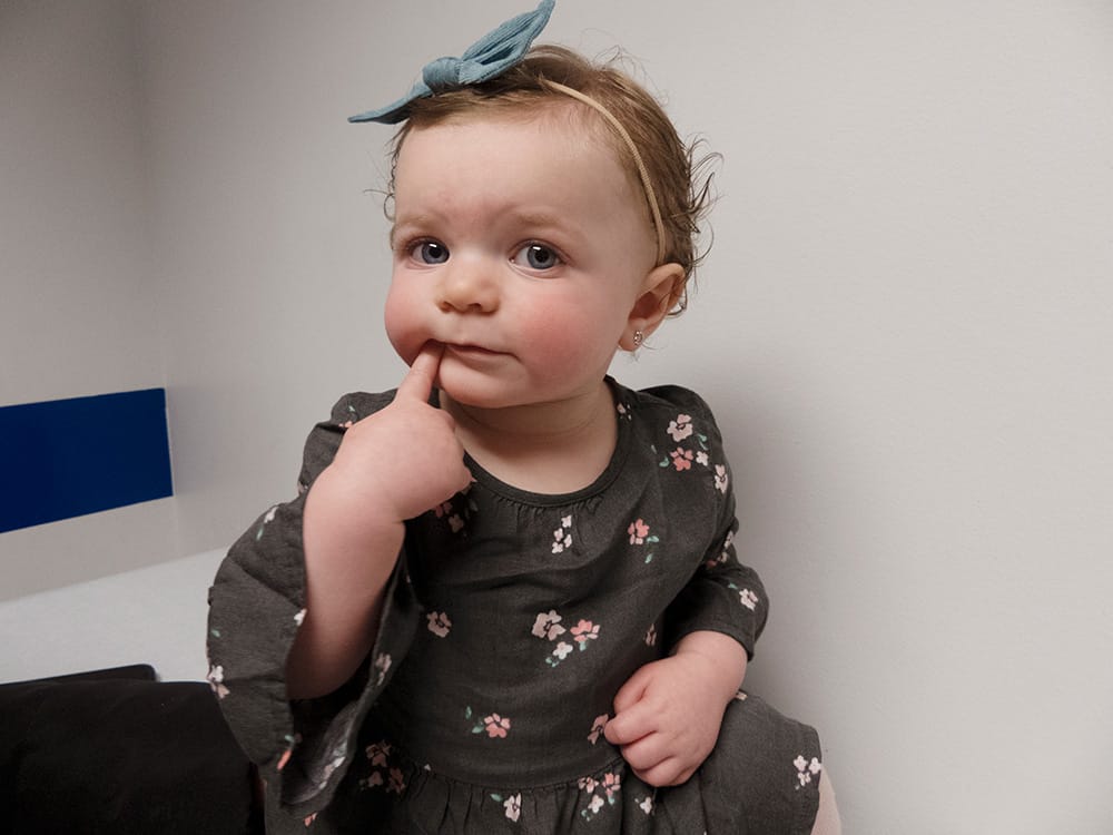 Baby waiting to see doctor in examination room