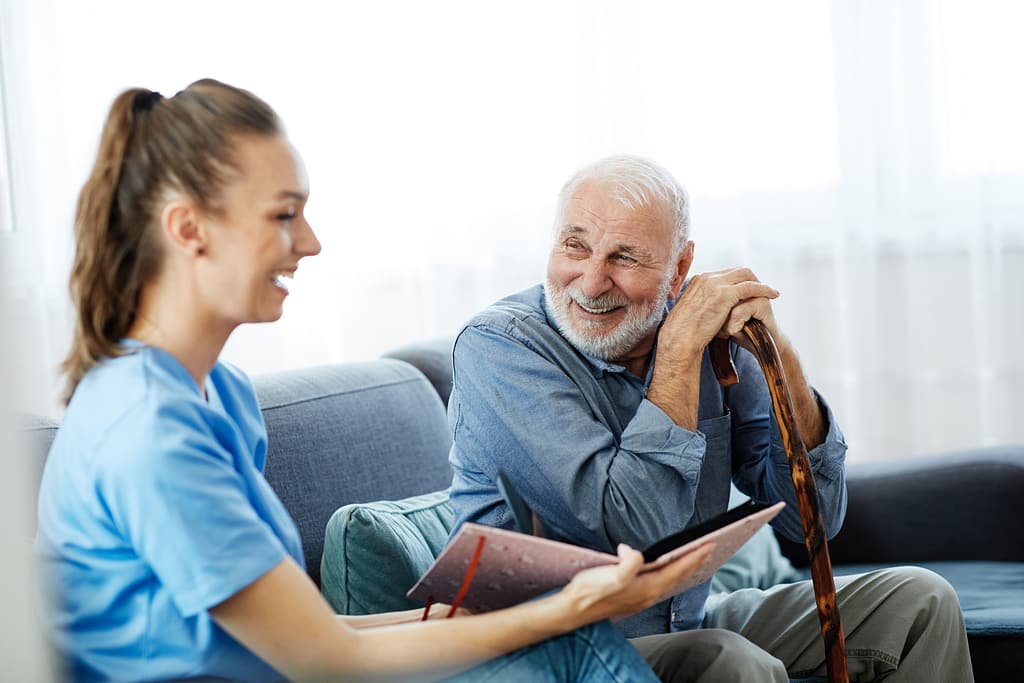 Caregiver showing images to senior patient