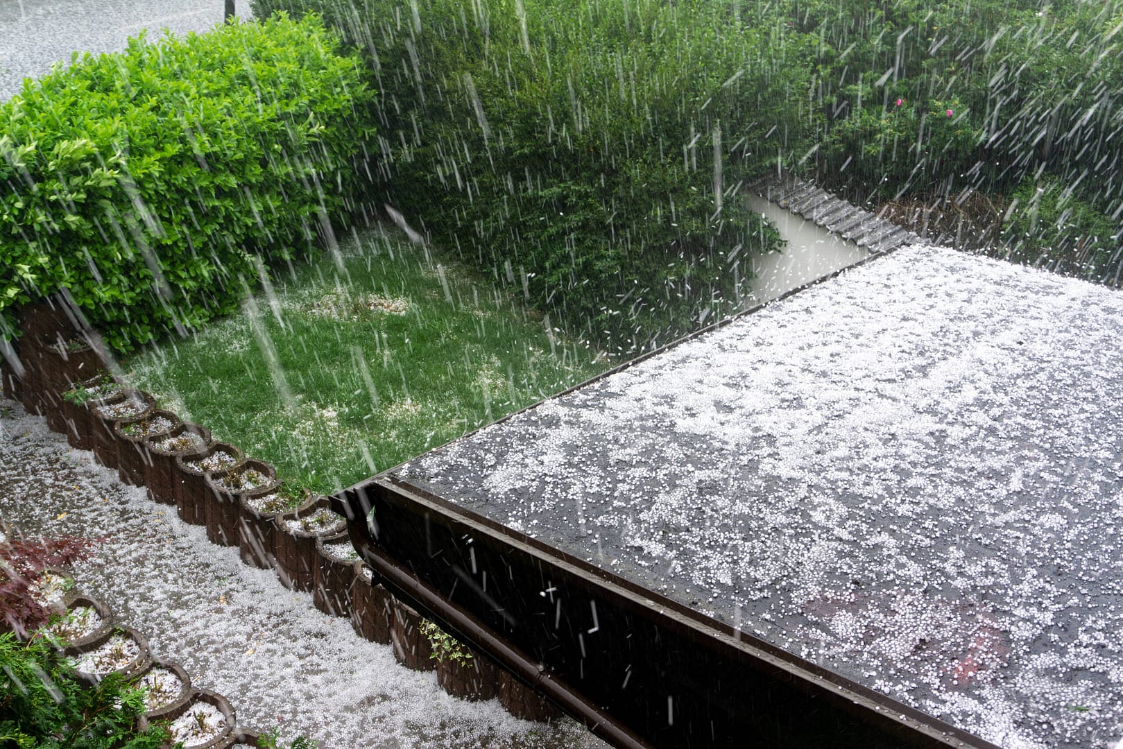 Hail falling onto a roof during a severe thunderstorm in Township, NJ.