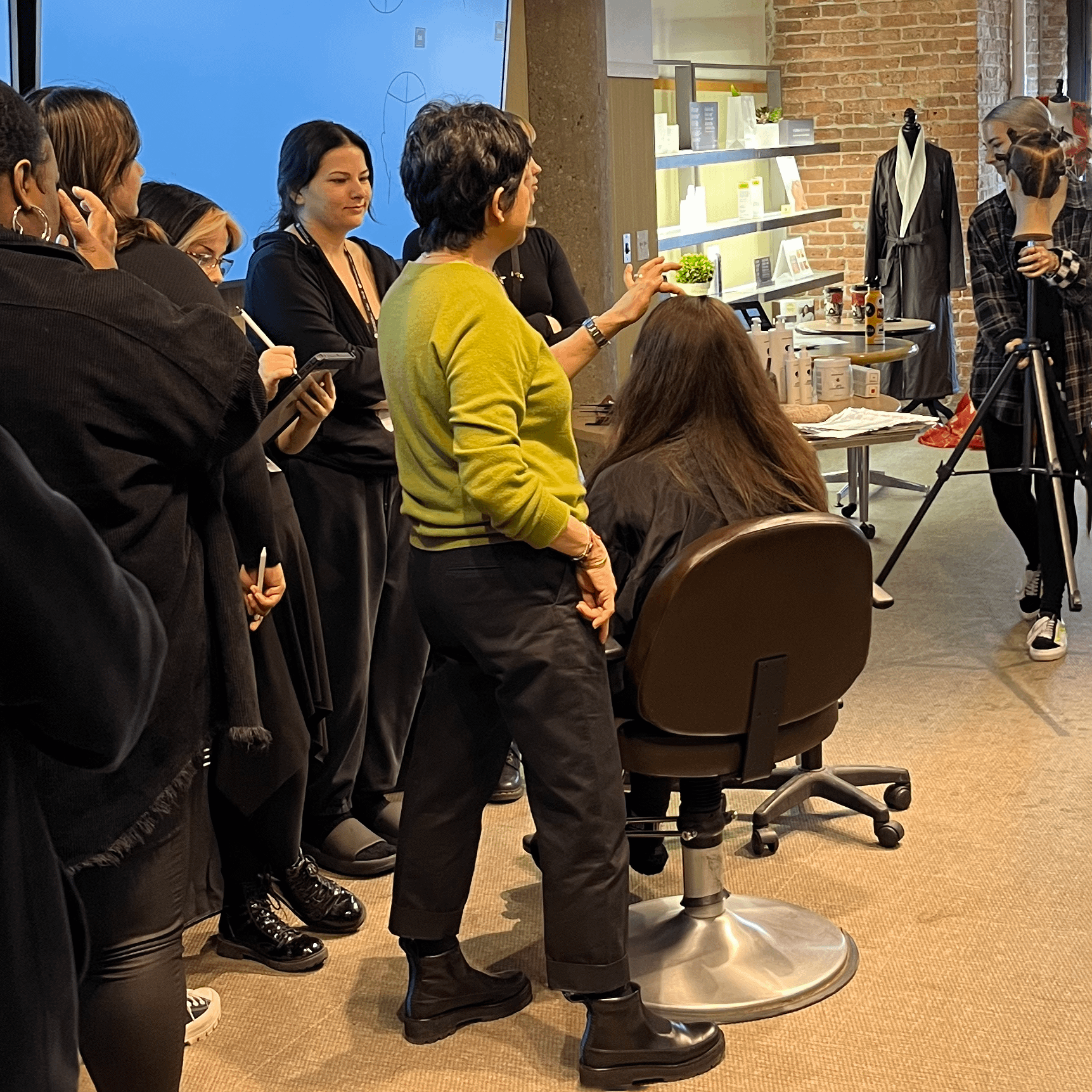Lupe Voss demonstrating how to section the hair for color application