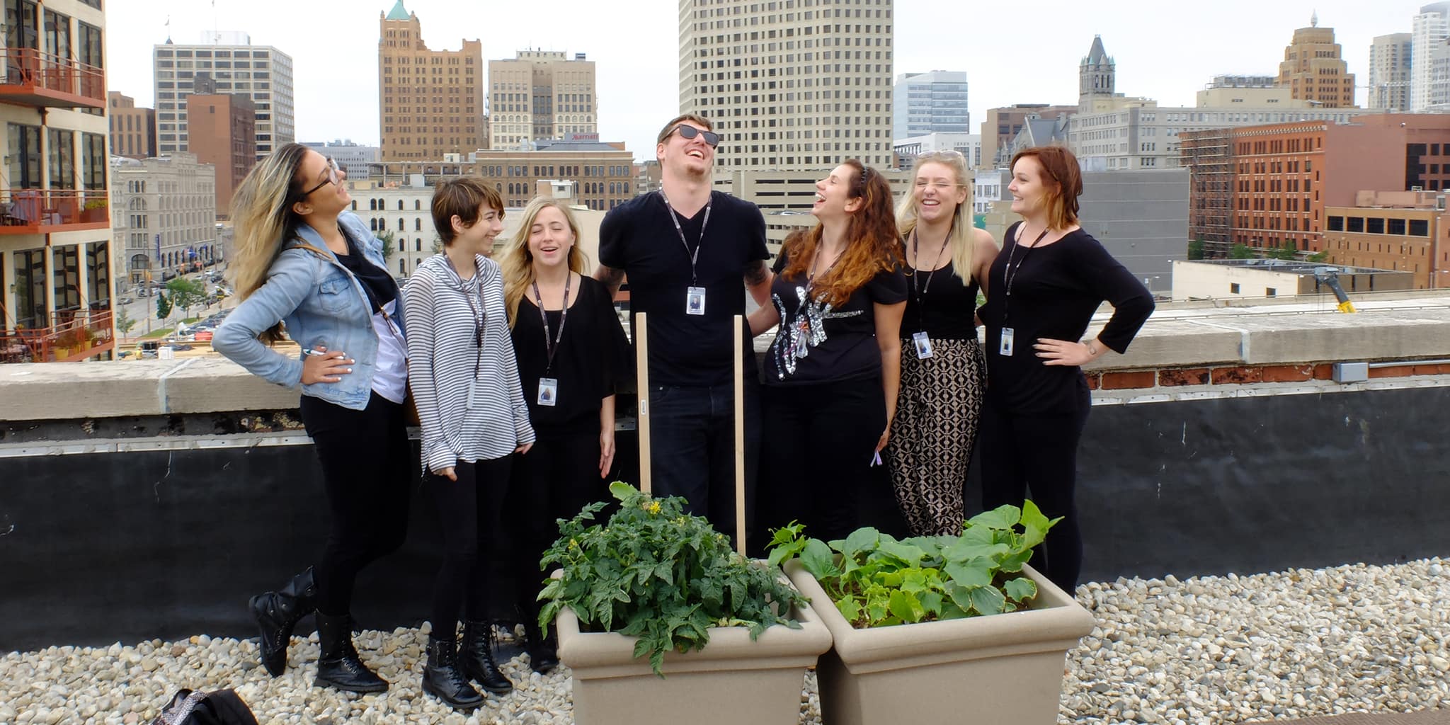 Green Team posing on the roof in milwaukee