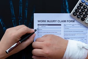 work injury claim form with injured hand