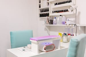 White nail station table in manicure and pedicure salon