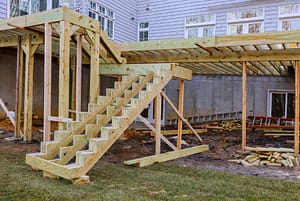 Deck being built outside of home