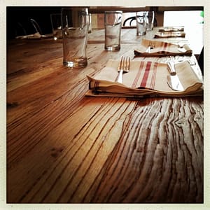 A rustic dining table made from reclaimed wood 