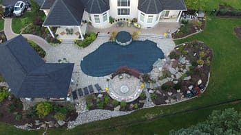 Overhead shot of underground pool protected with pool cover 