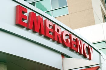 Large red emergency sign on hospital entrance