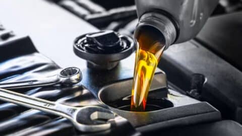 Oil being poured into a diesel engine