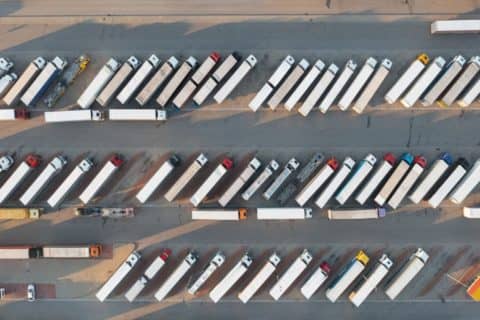 Tractor-trailers parked in a lot