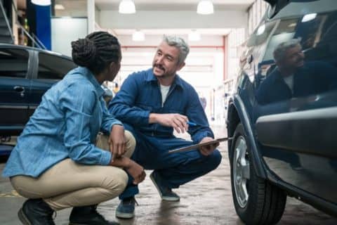 A mechanic explaining car tire issues