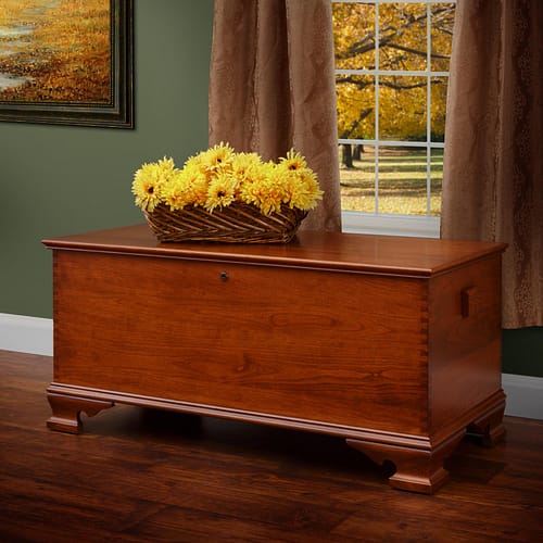 Yorktown Series chest by window with floral arrangement on top