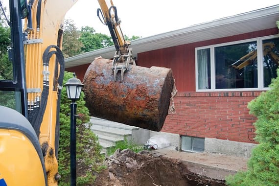An underground oil tank is removed