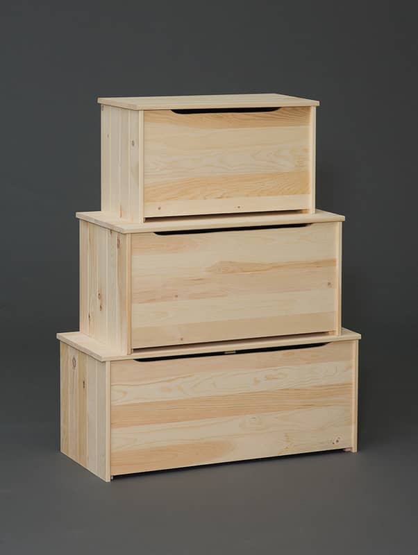 Three stacked pine storage chests