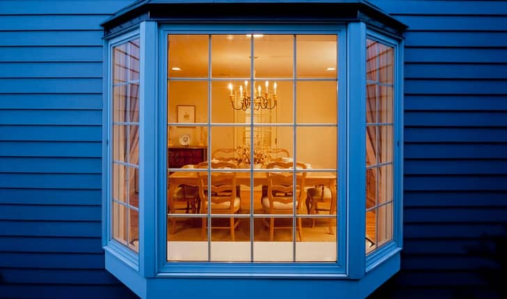 Blue house with bay window and dining room
