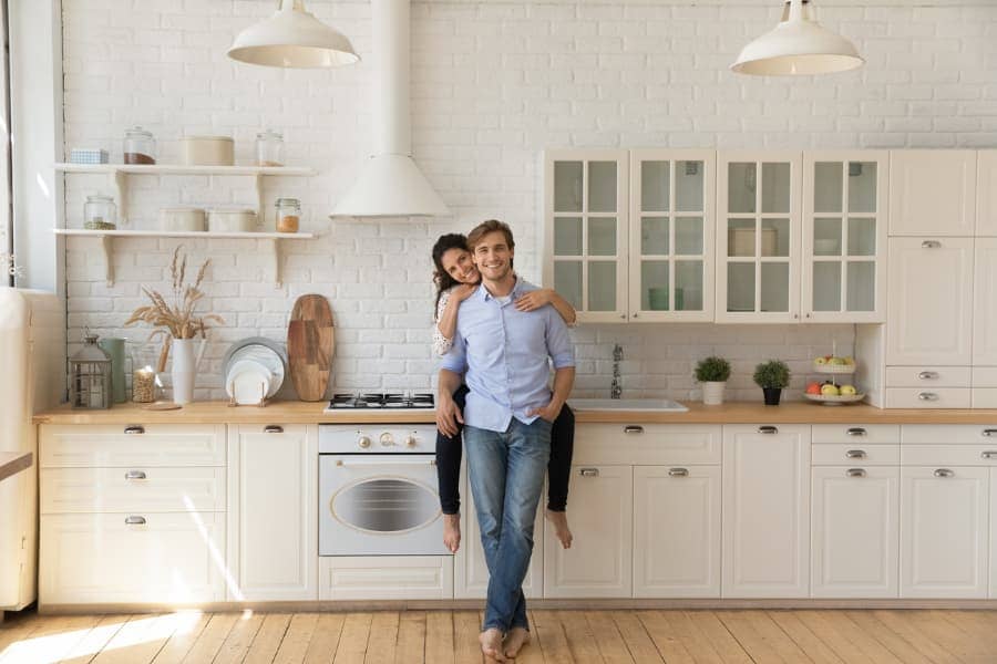 A happy couple in their remodeled kitchen.