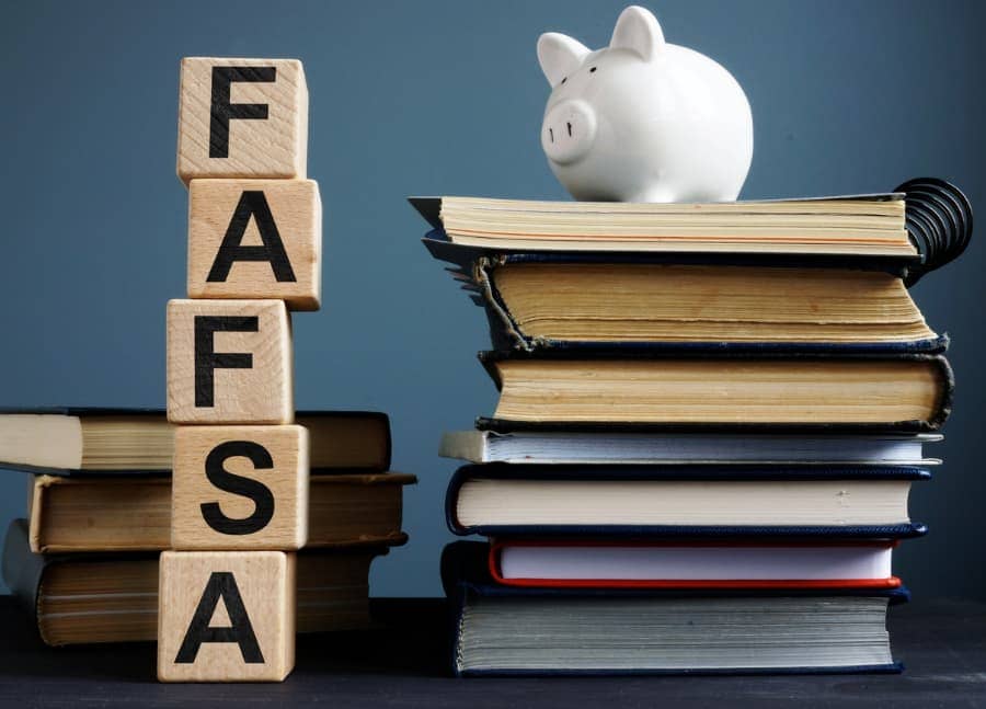 A stack of wooden cubes that show the acronym FAFSA.