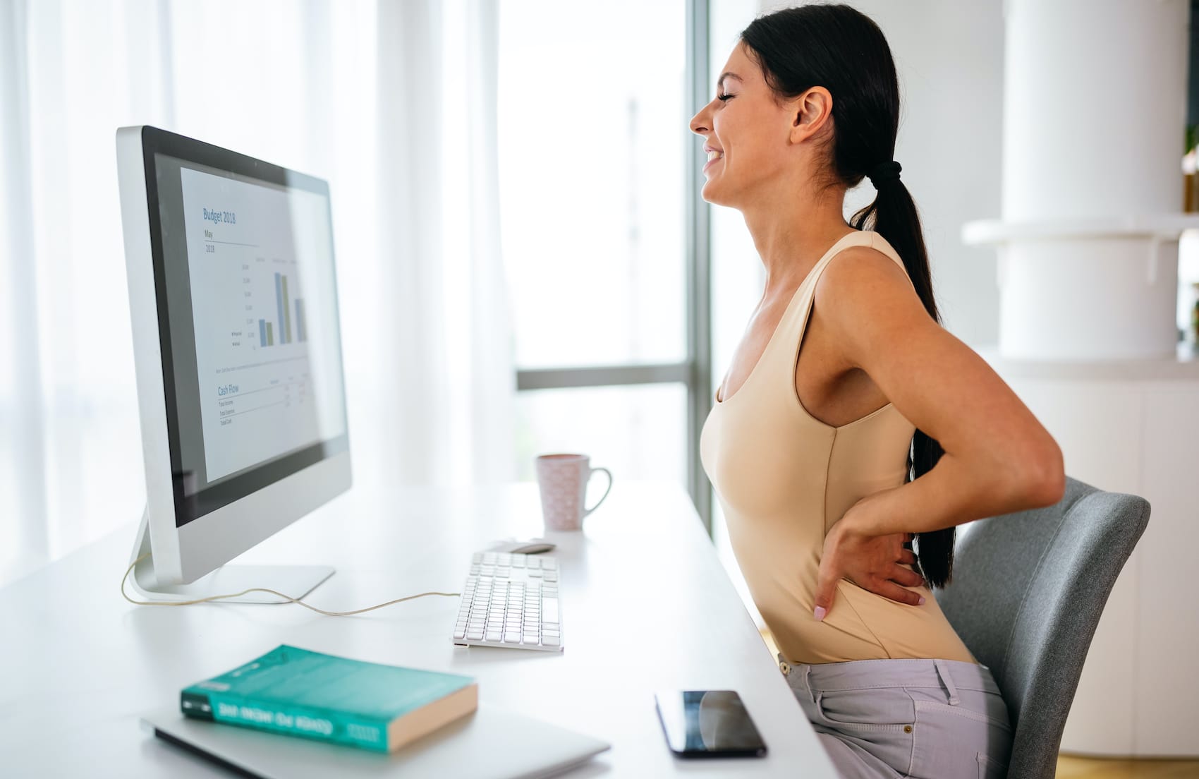 https://mltmpgeox6sf.i.optimole.com/w:auto/h:auto/q:mauto/f:avif/https://advancedcenternj.com/wp-content/uploads/2020/04/overworked-woman-with-back-pain-in-office-with-bad-T7PR4Y7.jpg